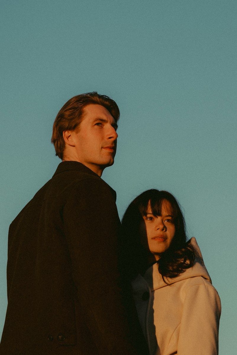 Man and woman look up at the sky